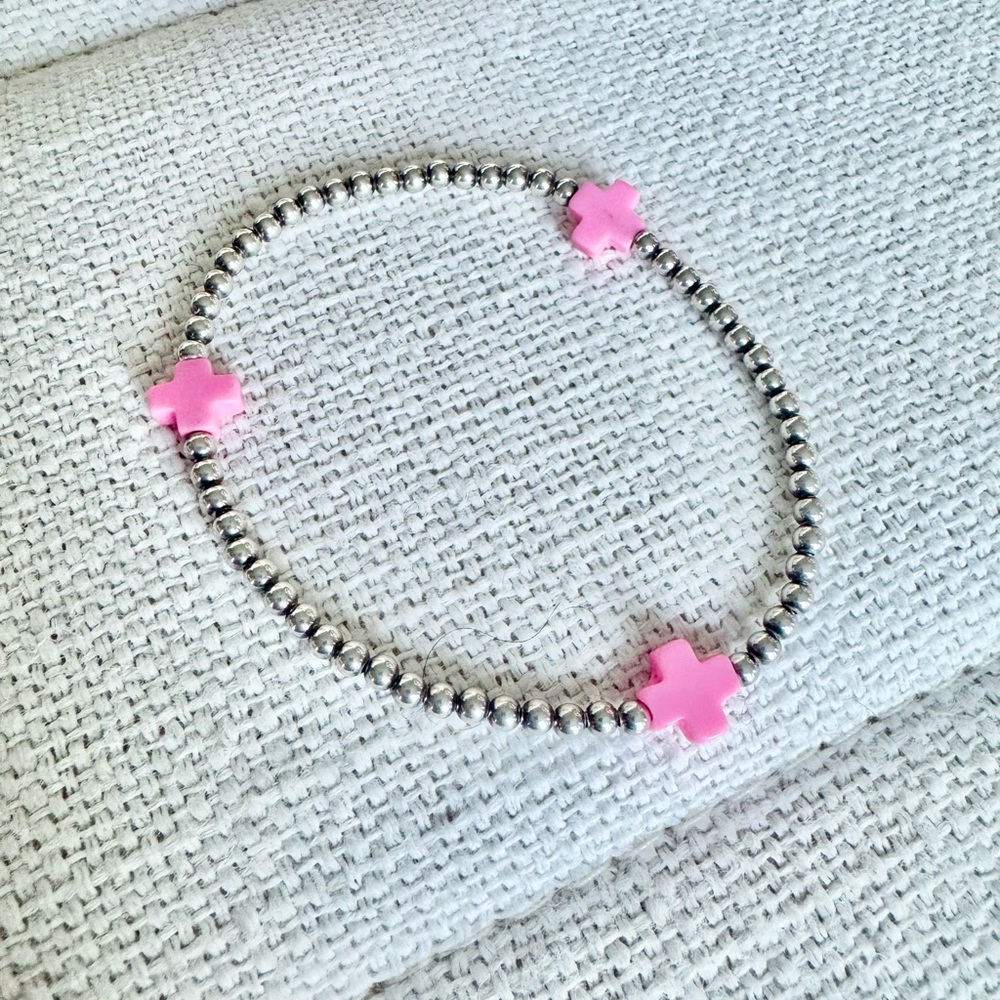 Enewton 3mm Sterling silver Signature Cross bracelet with bright pink crosses.
